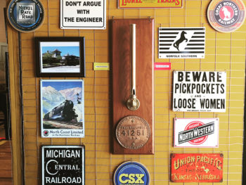 Wall with various railroad related signs: 