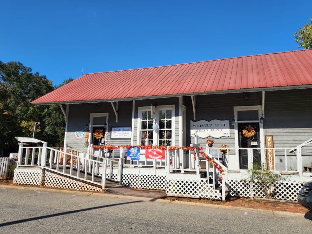 old depot turned shop with porch and wheel chair ramps - Train Depot in Historic Juliette, GA home to Fried Green Tomatoes